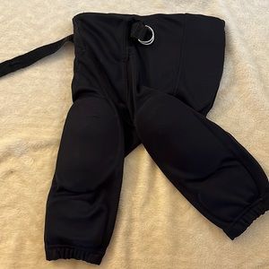 Like new boys football pants with hip and knees pads, worn and washed twice